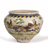 AN ANTIQUE SPANISH TIN GLAZED JARDINIERE depicting Gaucho's and their cattle, 44cm diameter x 37cm