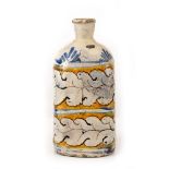 AN ANTIQUE CONTINENTAL TIN GLAZED BOTTLE VASE with stylised bands of leaf decoration and bearing a