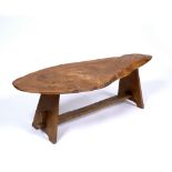 AN ELM COFFEE TABLE of naturalistic form, 126cm wide x 42cm deep x 40cm high