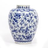 AN 18TH CENTURY DUTCH DELFT BLUE AND WHITE JAR decorated with exotic birds and foliage, manufactured
