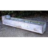 A LARGE OLD GALVANIZED WATER TROUGH OR PLANTER of riveted construction, 246cm long x 48cm wide x