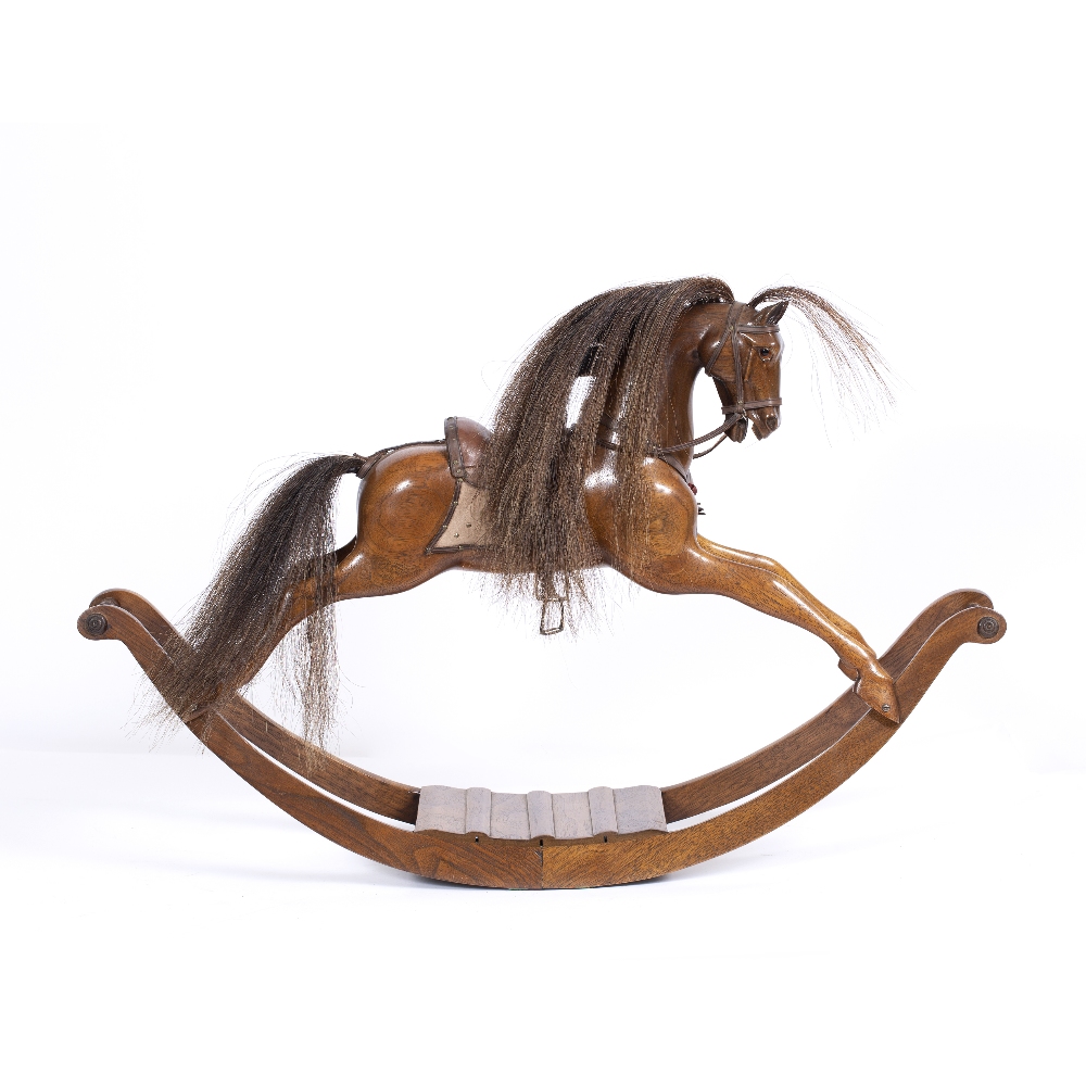 A MINIATURE CARVED HARDWOOD ROCKING HORSE with horse hair mane and tail and leather saddle, with - Image 2 of 2