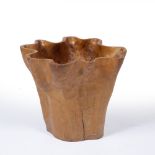 A CONTEMPORARY CARVED WOODEN BOWL or table base, with wavy edge, 47.5cm diameter x 40.5cm high