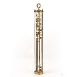 A GALILEO THERMOMETER with a series of glass bubbles in a tube in a lacquered brass frame, the