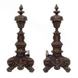 A PAIR OF 17TH CENTURY STYLE BRONZE FIRE DOGS with acanthus leaf cast urns and architectural