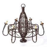 A LARGE BROWN PAINTED WROUGHT IRON ELECTROLIER with six scrolling branches, 110cm diameter x 110cm