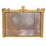 A REGENCY STYLE GILT OVERMANTLE MIRROR with reeded pilaster columns and decorative applied