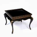 A LOW SQUARE BLACK LACQUERED OCCASIONAL TABLE with gilt decoration standing on cabriole legs, 65cm