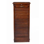 A LATE VICTORIAN OR EDWARDIAN OAK TAMBOUR FRONTED TALL NARROW FILING CABINET with nine slides