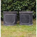 A PAIR OF CYLINDRICAL FAUX LEAD PLANTERS 38.5cm diameter x 35cm high