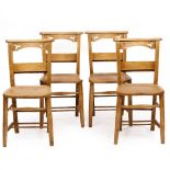 A SET OF FOUR VICTORIAN BEECHWOOD CHAPEL CHAIRS with pierced decoration, 41cm wide x 80cm high