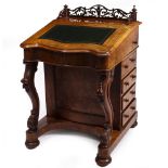 A VICTORIAN WALNUT DAVENPORT with fret carved gallery, green leather inset fall front, a satinwood