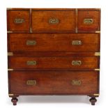 A MID TO LATE 19TH CENTURY CAMPAIGN CHEST with central secretaire drawer, two short drawers and