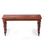 A MAHOGANY STOOL with turned supports, 86cm wide x 26cm deep x 44cm high Condition: later stain,