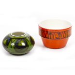 A GREEN GLAZED POOLE POTTERY VASE of ovoid form, 18cm diameter x 11cm high and an orange glazed
