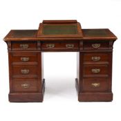 AN EDWARDIAN MAHOGANY PEDESTAL DESK with a leather inset sloping top, nine drawers, on plinth bases,