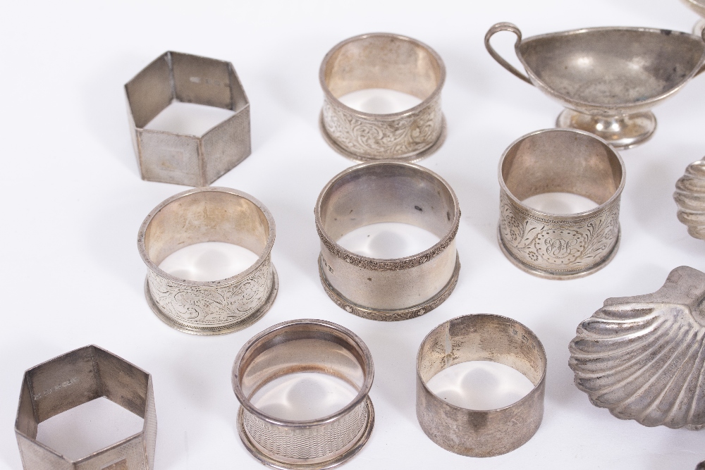 A SMALL QUANTITY OF WHITE METAL AND SILVER ITEMS to include silver napkin rings, scallop shaped - Image 5 of 5