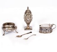 A SILVER PEPPERETTE with embossed decoration, 11cm in height; a 19th century silver salt and a