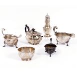 A SILVER TEAPOT with marks for Sheffield 1912 and two further silver sauce boats with marks for