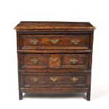 AN ANTIQUE CHEST OF DRAWERS of small proportions constructed from older elements with two drawers
