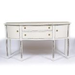 A GEORGIAN STYLE WHITE PAINTED SERPENTINE FRONTED SIDEBOARD with twin drawers flanked by cupboard