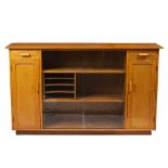 A MID 20TH CENTURY HAND MADE LIGHT OAK SIDE CABINET with cupboards and slides behind two sliding