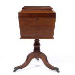 A 19TH CENTURY MAHOGANY TEA POY the top of sarcophagus form, on a turned support and tripod base