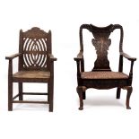 A CARVED OAK OPEN ARMCHAIR of large proportions with carved shaped eagle splat, turned supports,