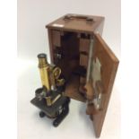 AN ERNEST LEITZ MICROSCOPE NUMBERED 106587 30cm in height, in a fitted mahogany case with a