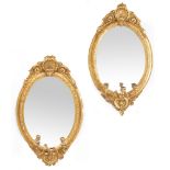 A PAIR OF 19TH CENTURY GILDED GESSO FRAMED GIRANDOLE MIRRORS each with scallop crests and three