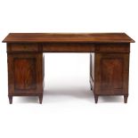 A LATE 19TH CENTURY MAHOGANY TWIN PEDESTAL DESK with three frieze drawers above cupboard below, with