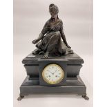 A LATE 19TH CENTURY BLACK SLATE MANTLE CLOCK with a bronzed spelter female figure above the