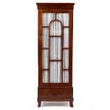 A 19TH CENTURY MAHOGANY TALL CABINET with a glazed door above a single drawer, splayed feet, 70cm