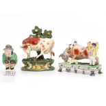 A MID 19TH CENTURY STAFFORDSHIRE FIGURAL POTTERY GROUP 'Bull Beating, Now Captain Lad', 18cm wide