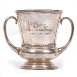 A TWIN HANDLED SILVER CUP engraved with 'Harry from his Godfather 2nd March 1907', marks for