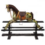 A LATE 19TH / EARLY 20TH CENTURY ROCKING HORSE the black painted frame marked 'Mr W.Bailey,