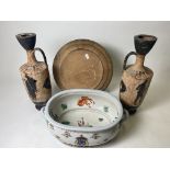 A CHINESE STYLE PORCELAIN FOOTBATH with armorial decoration and side handles, 56cm wide x 35cm