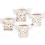 A SET OF FOUR MODERN ITALIAN PAINTED PINE CARVED CORINTHIAN HALF CAPITALS each 15.5cm wide x 8cm