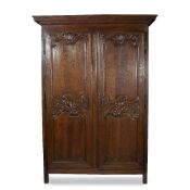 AN 18TH CENTURY FRENCH PROVINCIAL OAK ARMOIRE with carve fielded panelled doors and iron hinges with