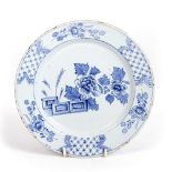 A LATE 18TH CENTURY DELFT BLUE AND WHITE PLATE with floral decoration, 22.5cm diameter At present,