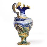 A 19TH CENTURY ITALIAN TIN GLAZED EWER in the renaissance revival style, 14cm diameter x 31cm high