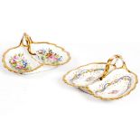 TWO 19TH CENTURY FRENCH PORCELAIN SHALLOW BOWLS of leaf form with scrolling gilded borders and