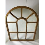 AN ARCHING WALNUT FRAMED WINDOW MIRROR with ten sections, 73cm x 105cm Condition: good condition