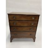 A 19TH CENTURY MAHOGANY CHEST OF FOUR LONG DRAWERS with brass ring handles and bracket feet,
