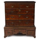 AN 18TH CENTURY OAK CHEST ON STAND with burrwood drawer fronts and brass handles, 103cm wide x