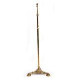 A VICTORIAN BRASS MESSENGER PATENT TELESCOPIC STANDARD LAMP with triform base, 50cm wide at the base