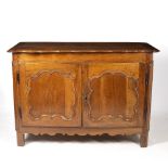 AN 18TH CENTURY FRENCH WALNUT SIDE CABINET with serpentine fronted edge to the top, panelled