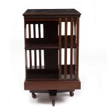 AN EDWARDIAN MAHOGANY ROTATING BOOKCASE by Maple & Co, 49cm wide x 49cm deep x 85cm high