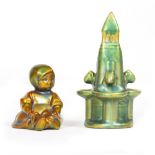 A ZSOLNAY PECS GREEN LUSTER PORCELAIN FIGURINE of a seated child, 6cm wide x 8cm high; a further