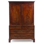 A 19TH CENTURY MAHOGANY LINEN PRESS with twin panel doors above two short and three long drawers